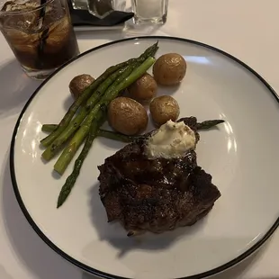 Ribeye steak with madeira demi glaze, creamer potatoes, &amp; asparagus.