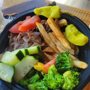 Theo&apos;s bowl with roaster lamb, seasonal veg over basmati rice with some fries