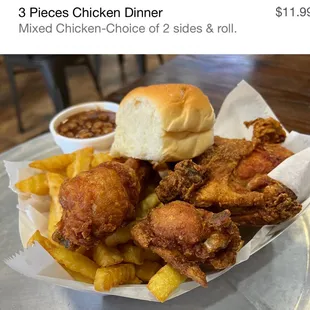 a plate of fried chicken and sides