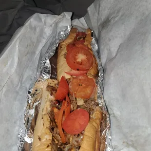 a hot dog with tomatoes
