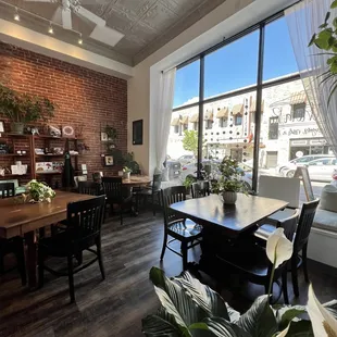 a dining room with a brick wall