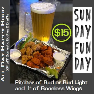 a glass of beer and a plate of fried wings