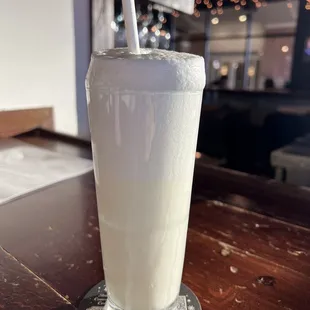 a glass of milk on a table