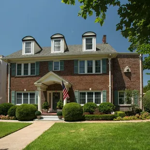 A classic home enhanced with Thermal Single Hung and Double Hung windows, along with a Therma-Tru door, sidelites and Larson storm door