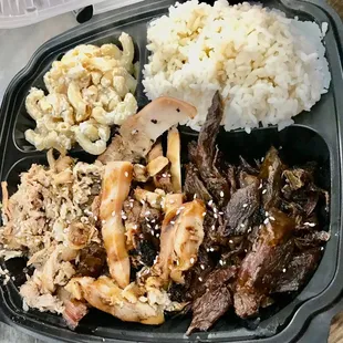 Hawaiian plate with pulled pork, teriyaki chicken and BBQ beef. Sides of rice and macaroni salad.