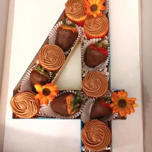 a number 4 made out of cupcakes