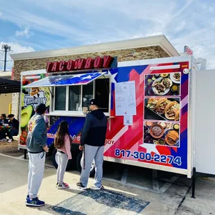 people ordering food from a food truck