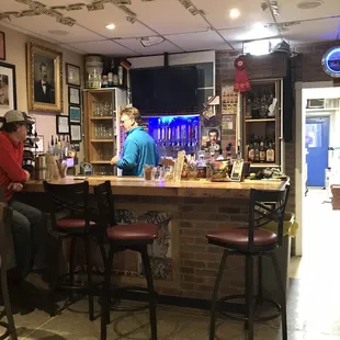 There's a four seat bar plus plenty of four top tables and longer tables near the front.