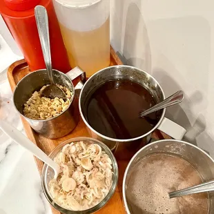 Sauces: chili paste(red), fish sauce(white bottle), peanuts, tamarind sauce, chopped lemon grass, anchovy sauce(bottom)