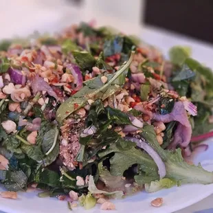 Bo Tai Chanh $25.00 Beef salad with a side of anchovy sauce &amp; fresh cut chili's