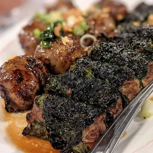 Charbroiled ground beef sausage and wrapped in betel leaf. Everyone's favorite...super tasty