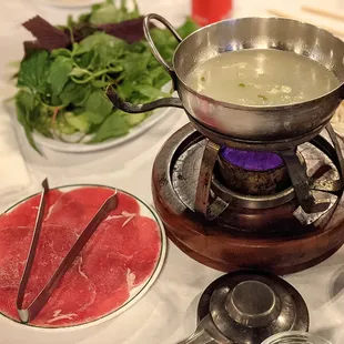 Beef tenderloin Hotpot, you cook it yourself. They'll bring you a small pot of broth heated by a tiny portable flame