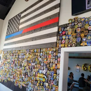 american flag and badges on wall