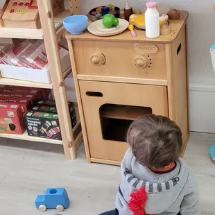 Checking out the cool open play toys with my son at Things They Love