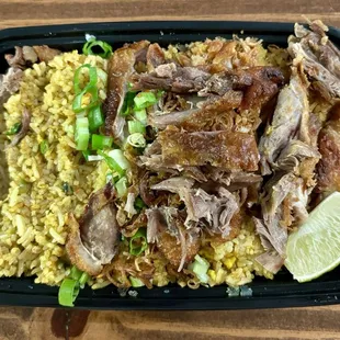Crispy Duck Fried Rice  Authentic Thai fried rice, egg, scallion, curry powder, garlic, fried shallot and crispy duck.