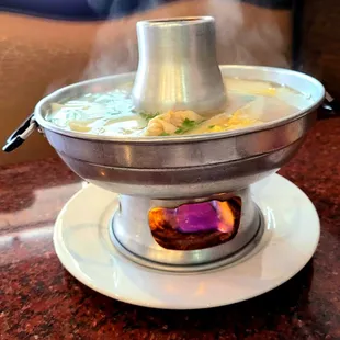 a steaming pot of soup