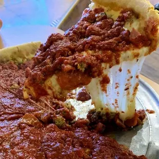 a slice of deep dish pizza