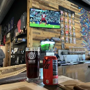 Posted up at corner of bar. Soccer, brew, and food!