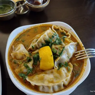 Jhol Momo (Steamed MoMo dunked in Sichuan pepper spiced roasted tomato sauce)