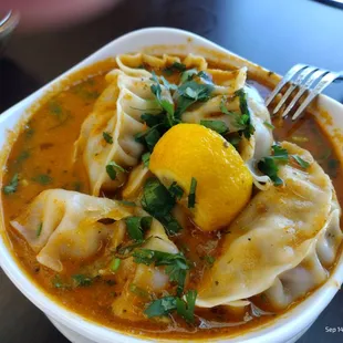 Jhol Momo (Steamed MoMo dunked in Sichuan pepper spiced roasted tomato sauce)