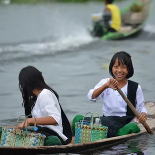 Kids rowing to school, Inle Lake- Myanmar.