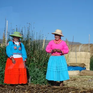 Local people on the floating village in Lake Titicaca, Peru.