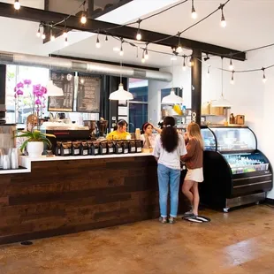 two people standing in front of the counter