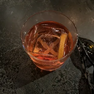 a drink in a glass on a table