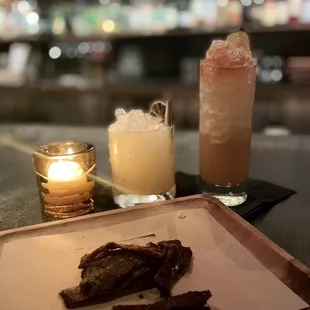 a plate of steak and a drink