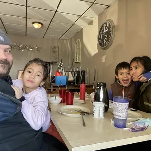 a family sitting at a table