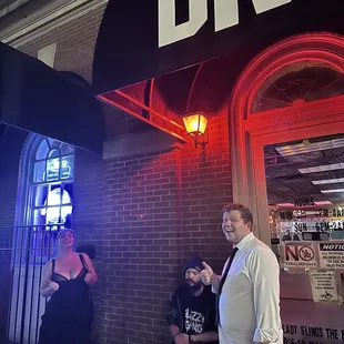 a group of people standing outside of the dive
