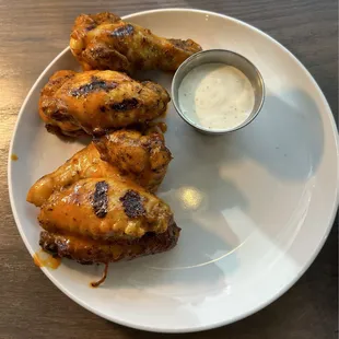 Smoke and charred buffalo wings