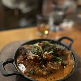 a skillet of food on a table