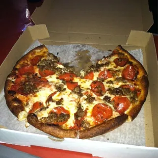 a half eaten pizza in a box