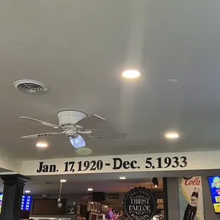 a ceiling with a sign that reads jan 17th - dec 5, 1933