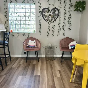 a living room with two chairs and a table