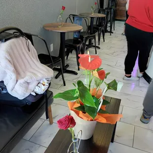 a woman walking in a coffee shop