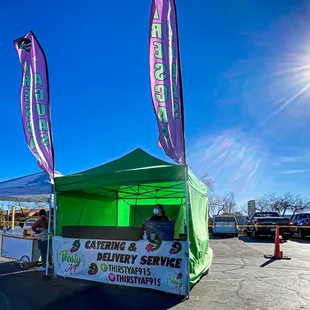 a tent set up in a parking lot