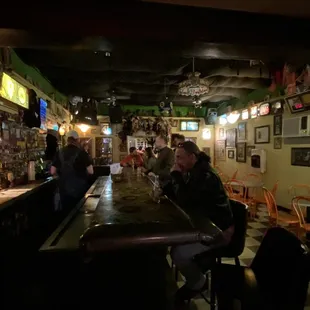 people sitting at a bar