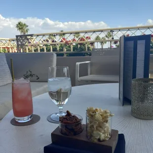 Strawberry Rhubarb Collins, and complimentary bar snacks.