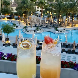 two cocktails on a balcony