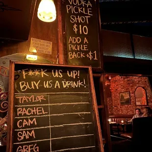 a blackboard with a list of drinks