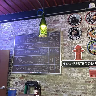 a menu on a brick wall