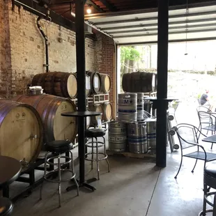 barrels stacked on tables and stools