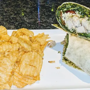 Chicken Pesto Wrap with Arugula, Tomato, Mozzarella &amp; Provolone.