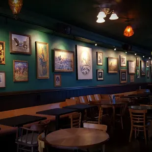 tables and chairs in a dimly lit room