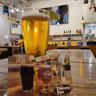 a glass of beer on a table