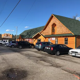 cars parked in front of the restaurant