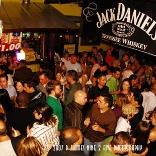 a crowd of people at a bar