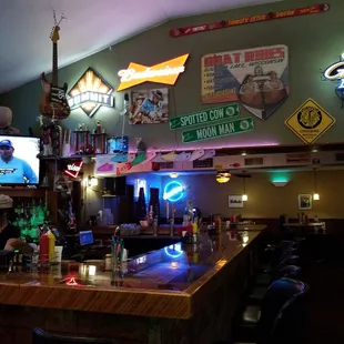 a bar with neon signs